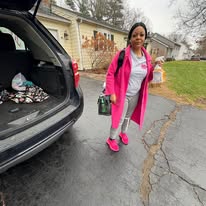 Kay Kleaners team member in bright pink workwear