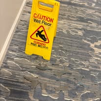 Freshly cleaned floor with caution sign